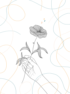 Human hand holding a flower